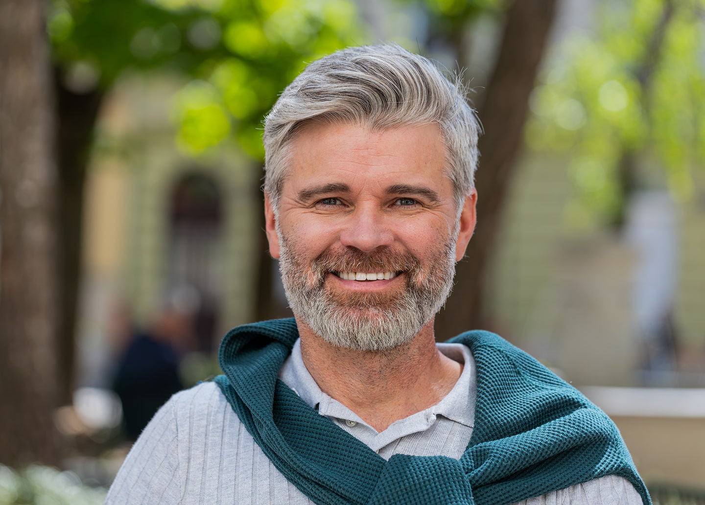 Candidates for implant dentures include patients missing most teeth seeking secure, natural-looking smiles