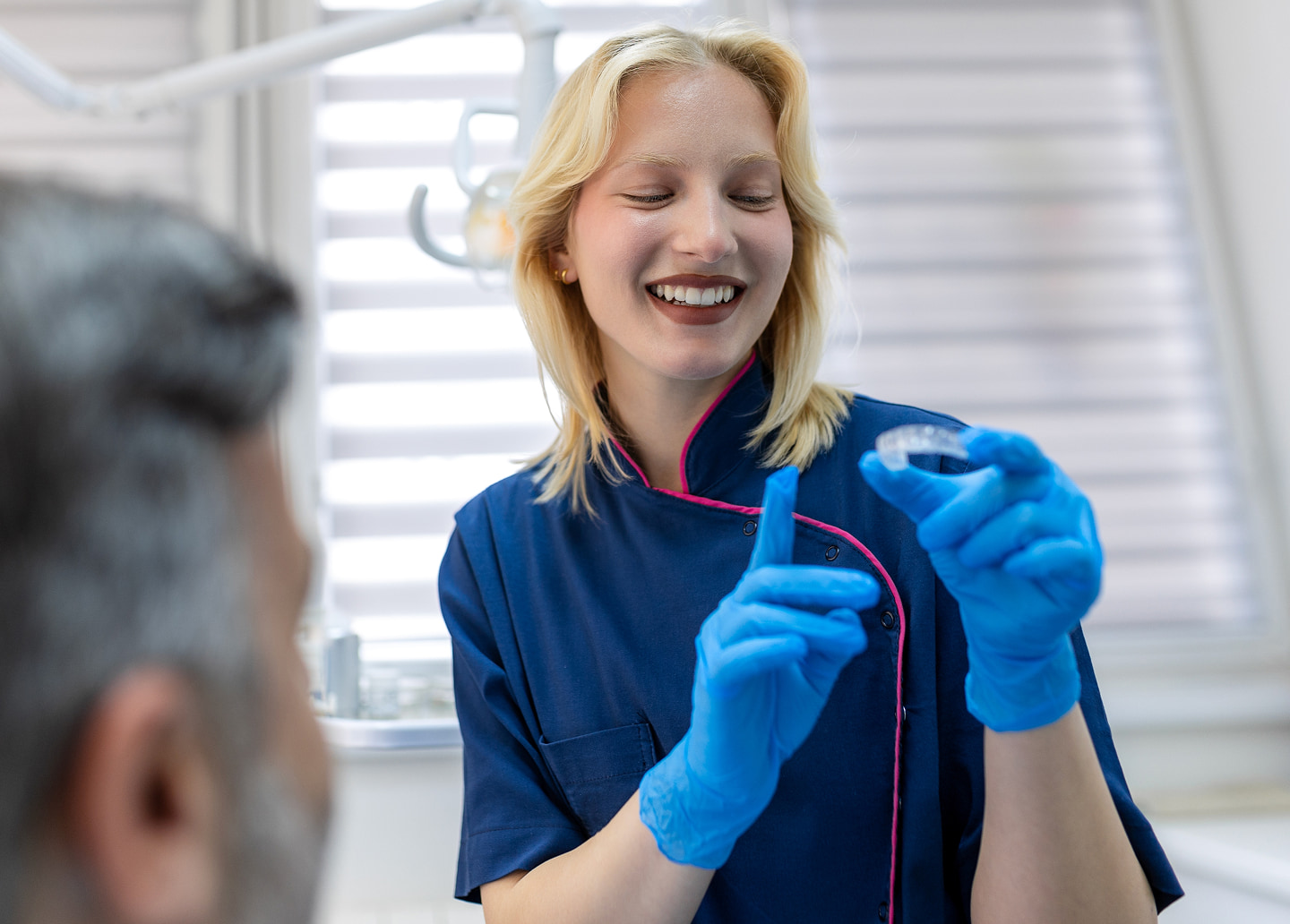 Tips for caring for Invisalign aligners, including rinsing, gentle brushing, soaking, and keeping them in their case